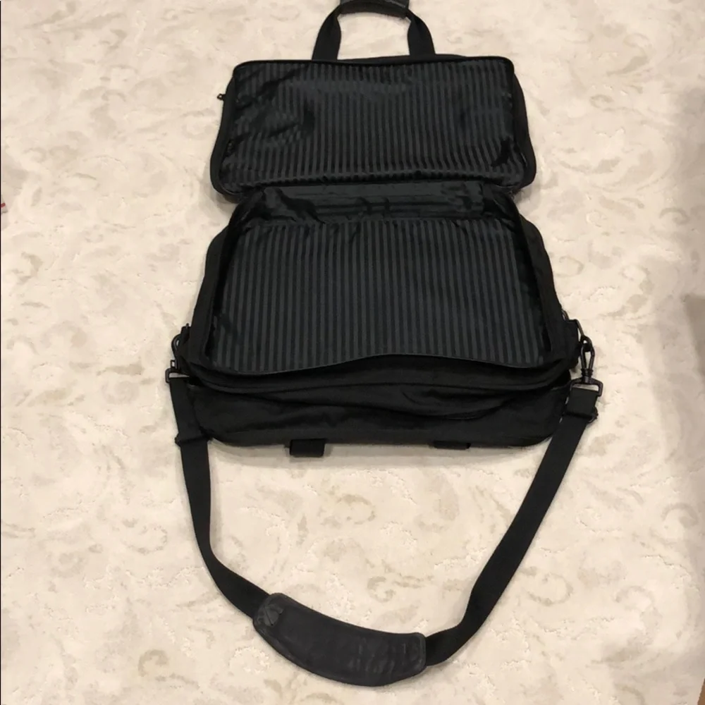 Tumi expandable crossbody suitcase/briefcase